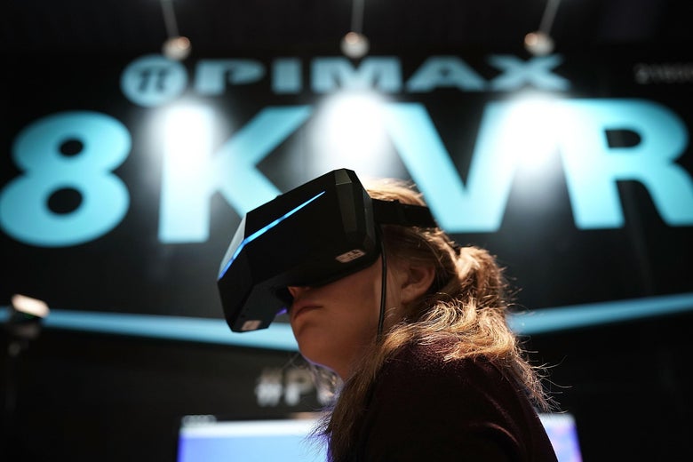 LAS VEGAS, NV - JANUARY 10: A woman participates in an 8K VR experience during CES 2018 at the Las Vegas Convention Center on January 9, 2018 in Las Vegas, Nevada. CES, the world's largest annual consumer technology trade show, runs through January 12 and features about 3,900 exhibitors showing off their latest products and services to more than 170,000 attendees. (Photo by Alex Wong/Getty Images)